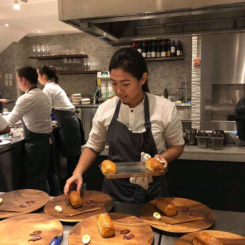 Chef Hanna Sanchez plating service at the pass